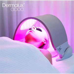 Woman having a 30 minute session of Dermalux to rejuvenate her skin.