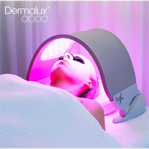 Woman Dermalux rejuvenation Woman having a 30 minute session of Dermalux to rejuvenate her skin.